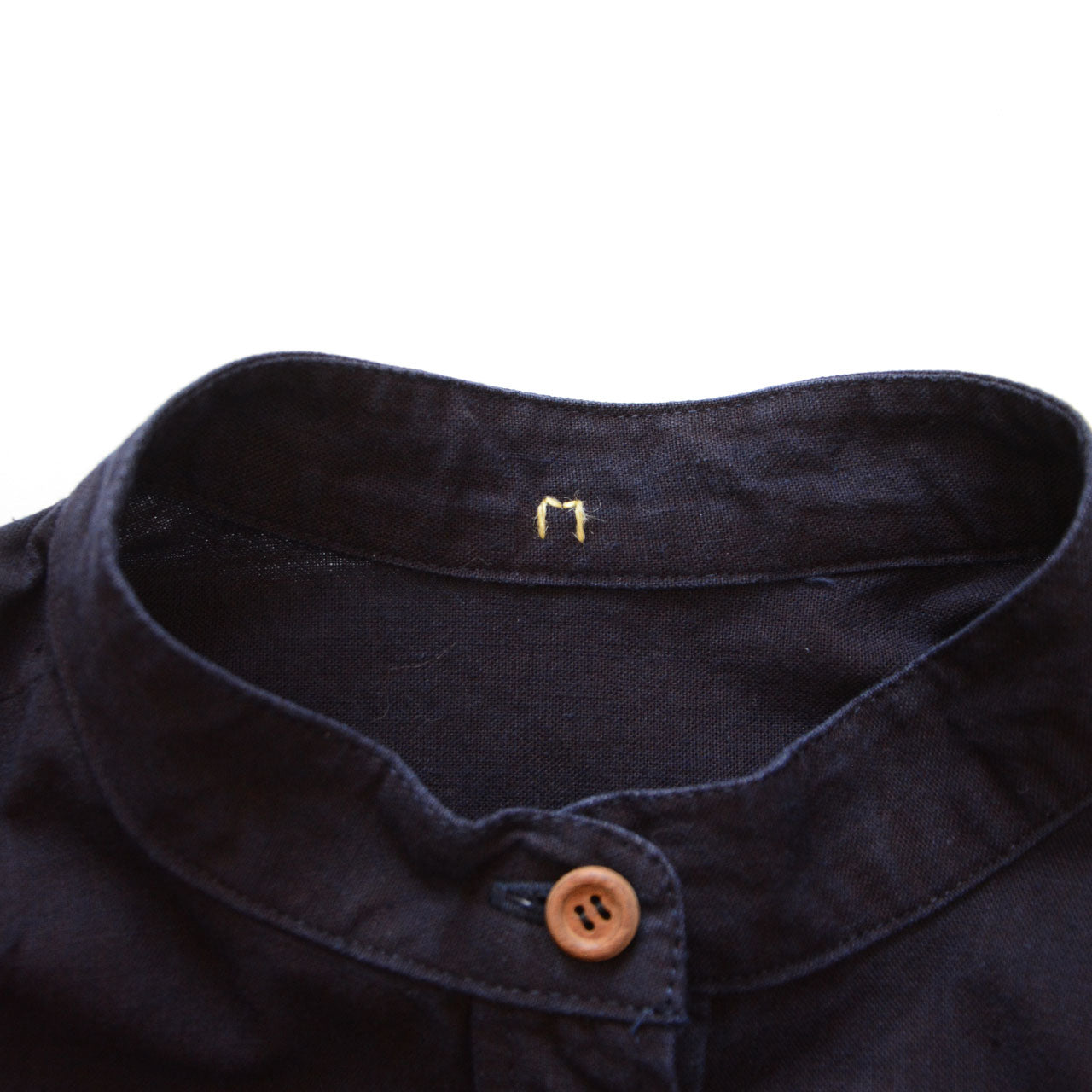 Hand-sewn M size tag on vintage Japanese indigo work shirt