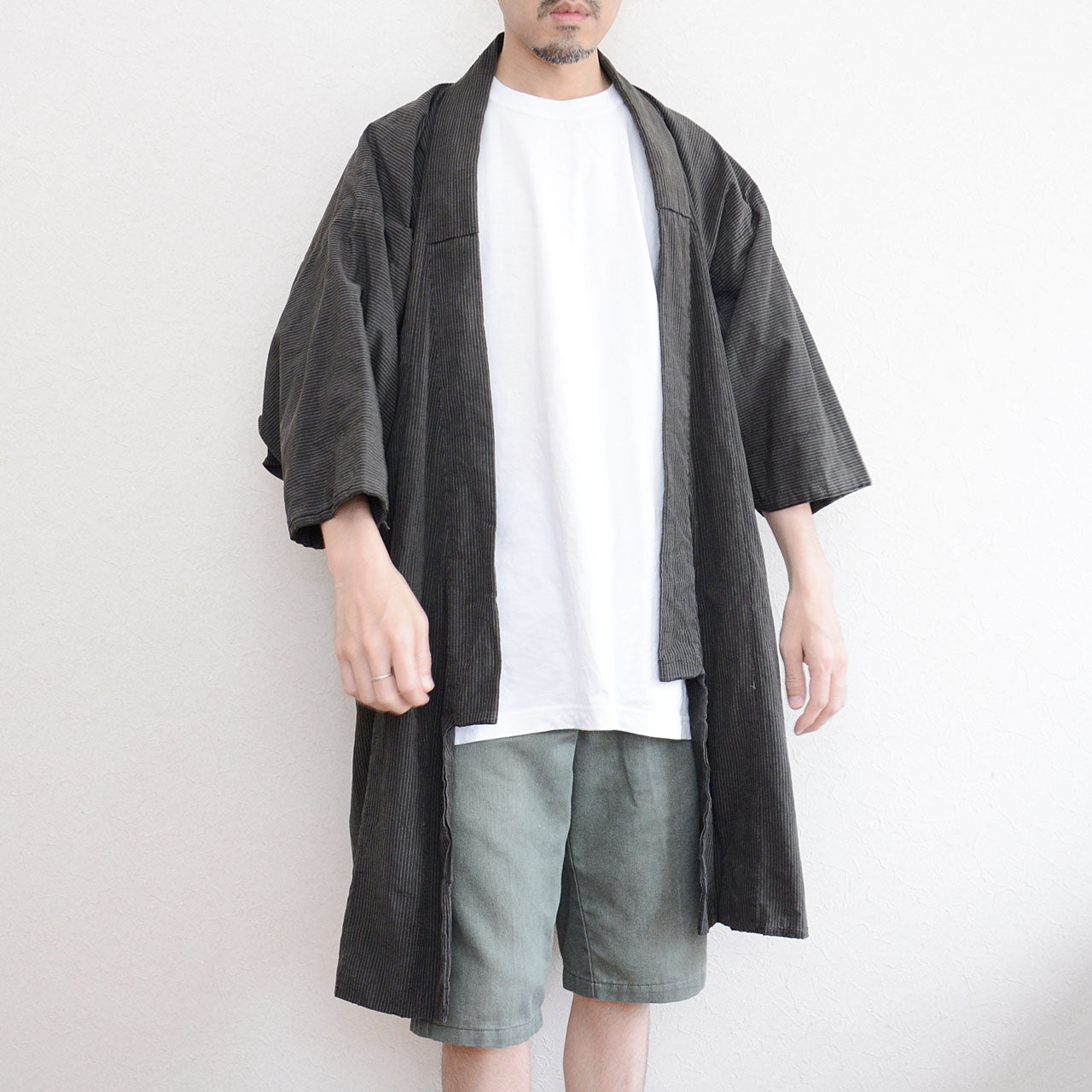 Rural Japanese workwear with large tears and faded fabric