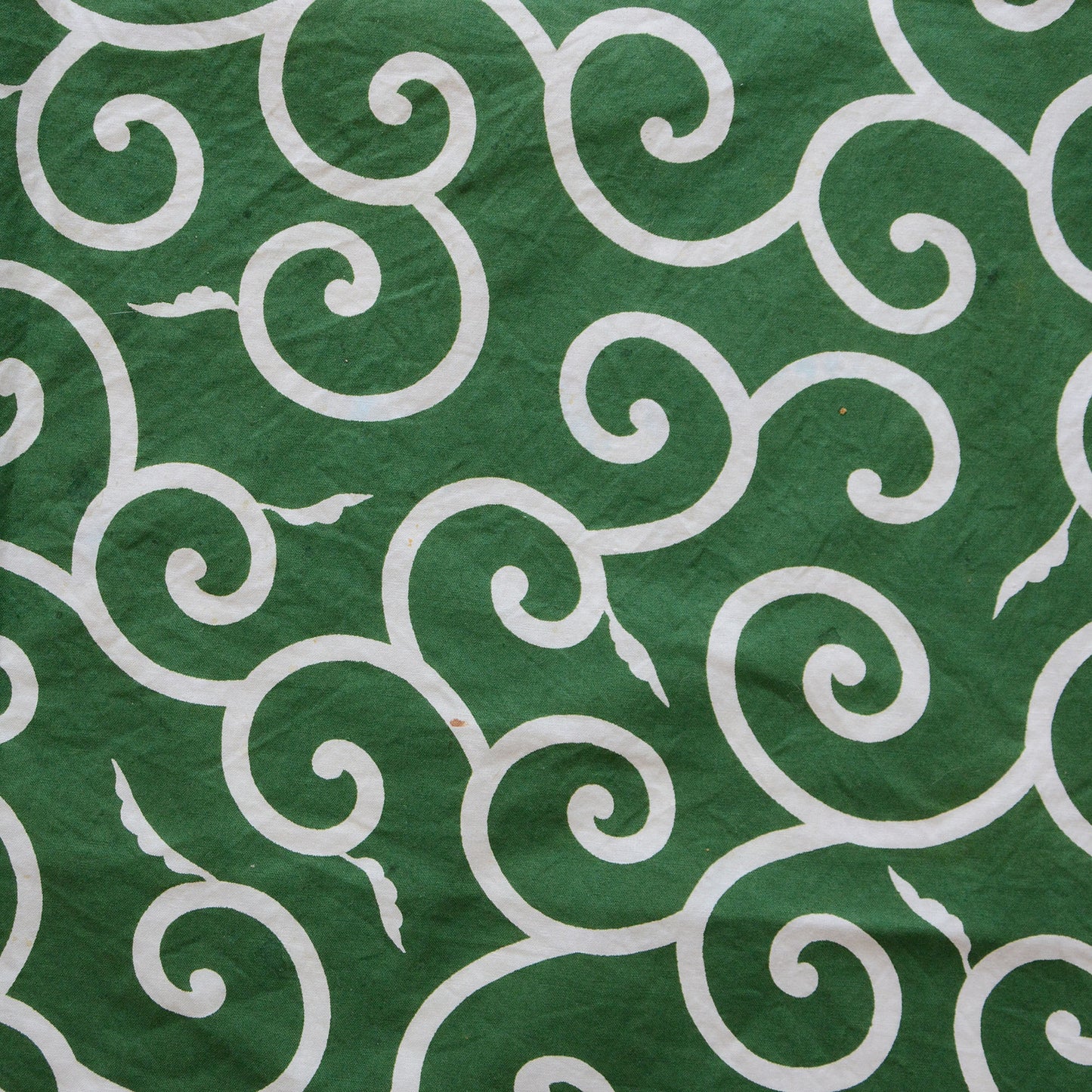 Green furoshiki cloth with traditional Japanese karakusa pattern