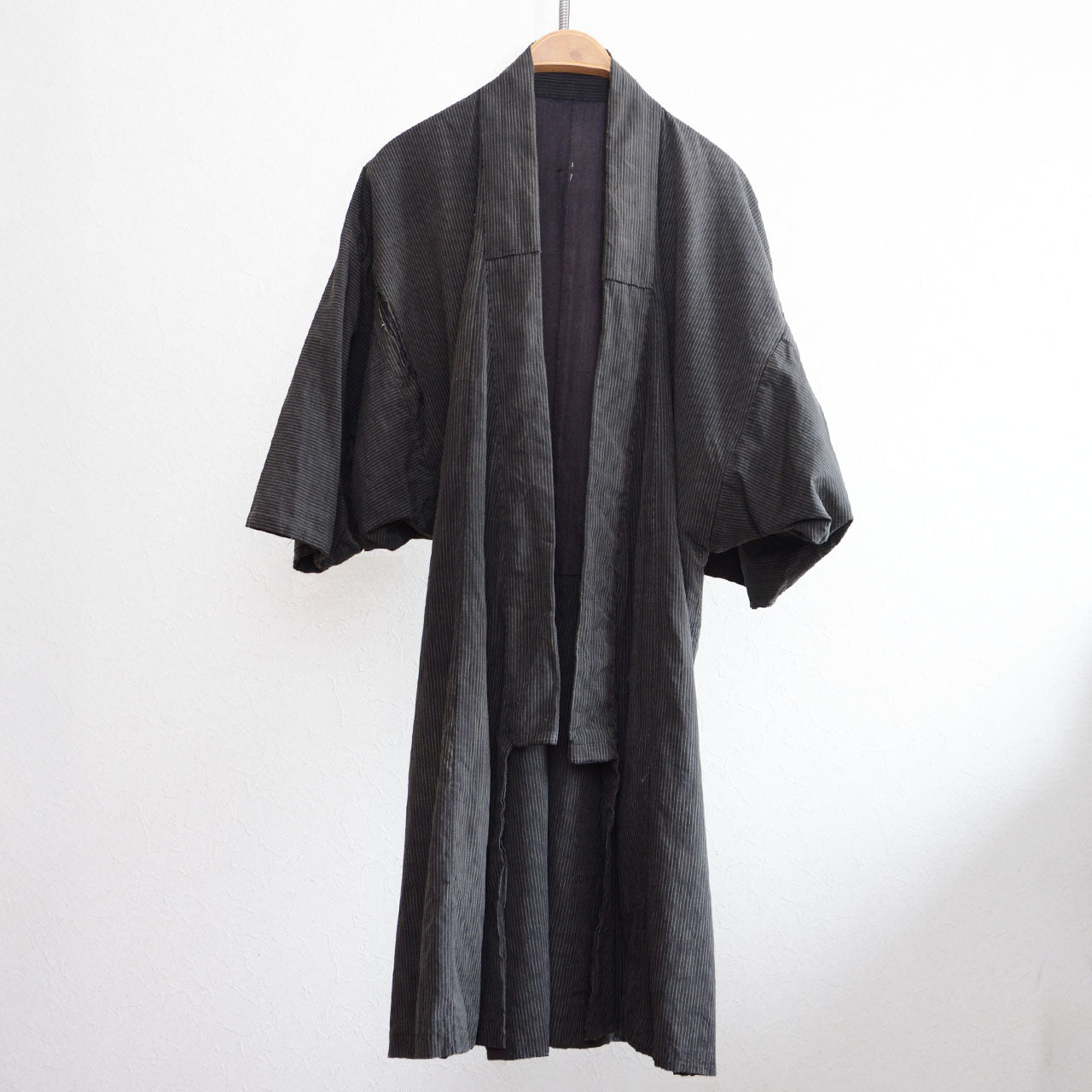 Vintage Japanese noragi jacket with heavy fading and striped cotton fabric