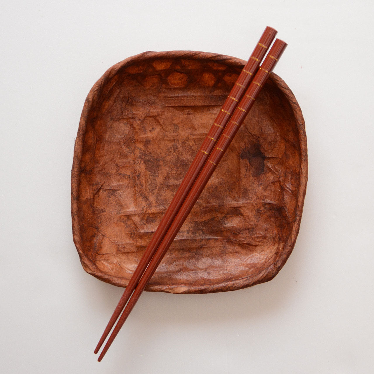 Bamboo chopsticks featuring decorative gold lines
