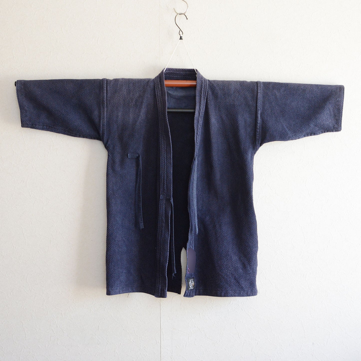 Traditional kendo jacket in soft, faded cotton material.