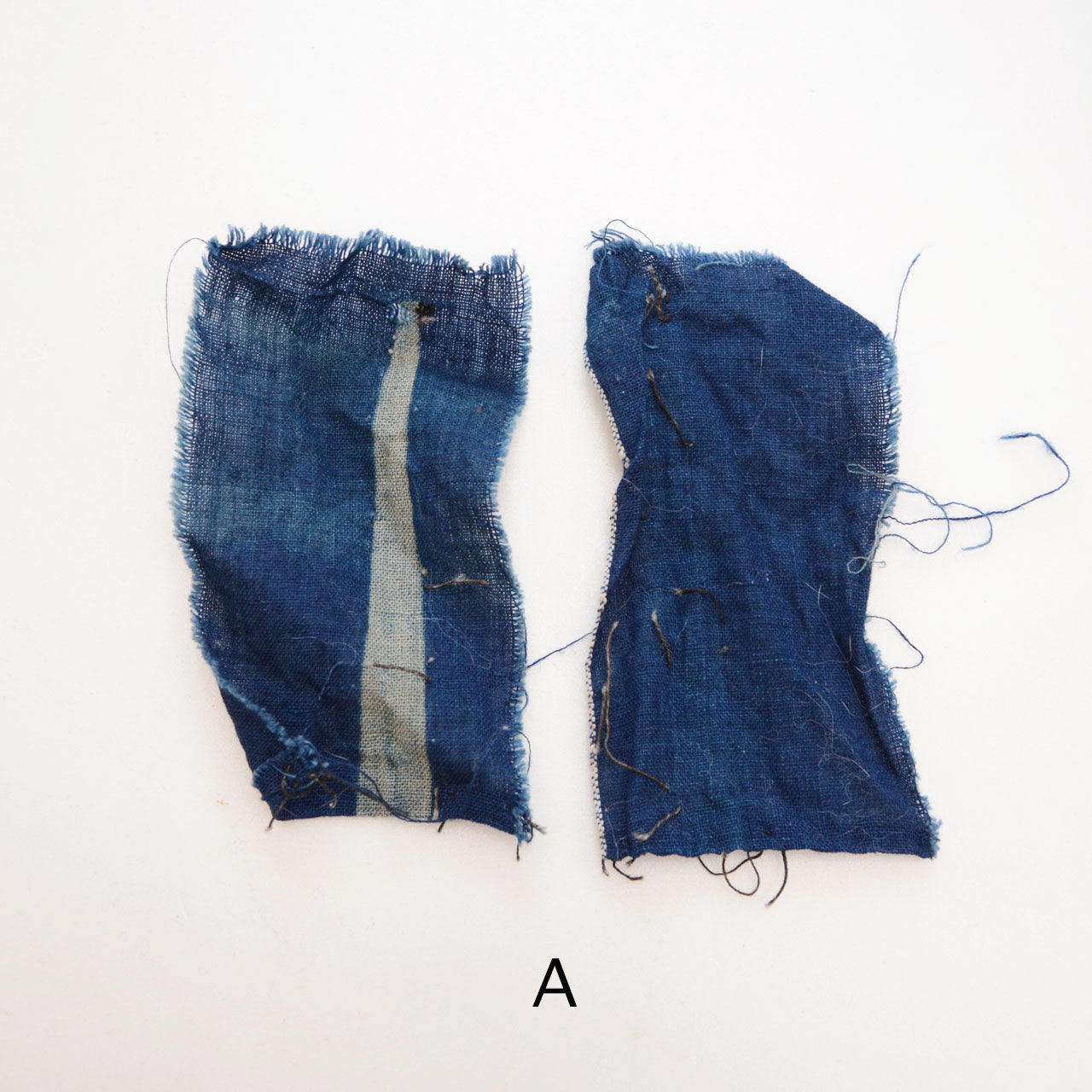 Assorted Japanese vintage fabric pieces featuring indigo stripes and Yukinko kasuri design