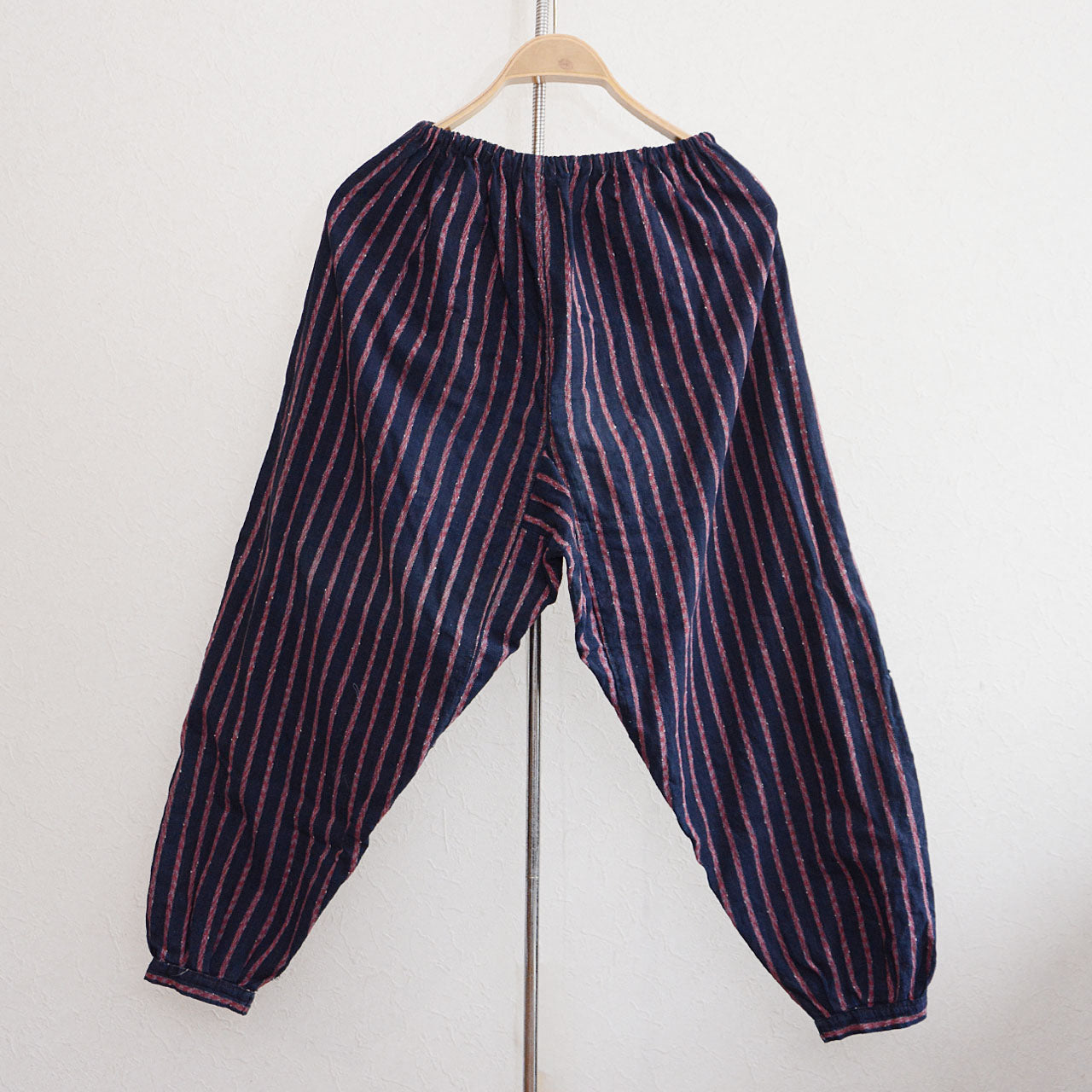 Traditional noragi workwear pants from early Showa era featuring metal kohaze closures