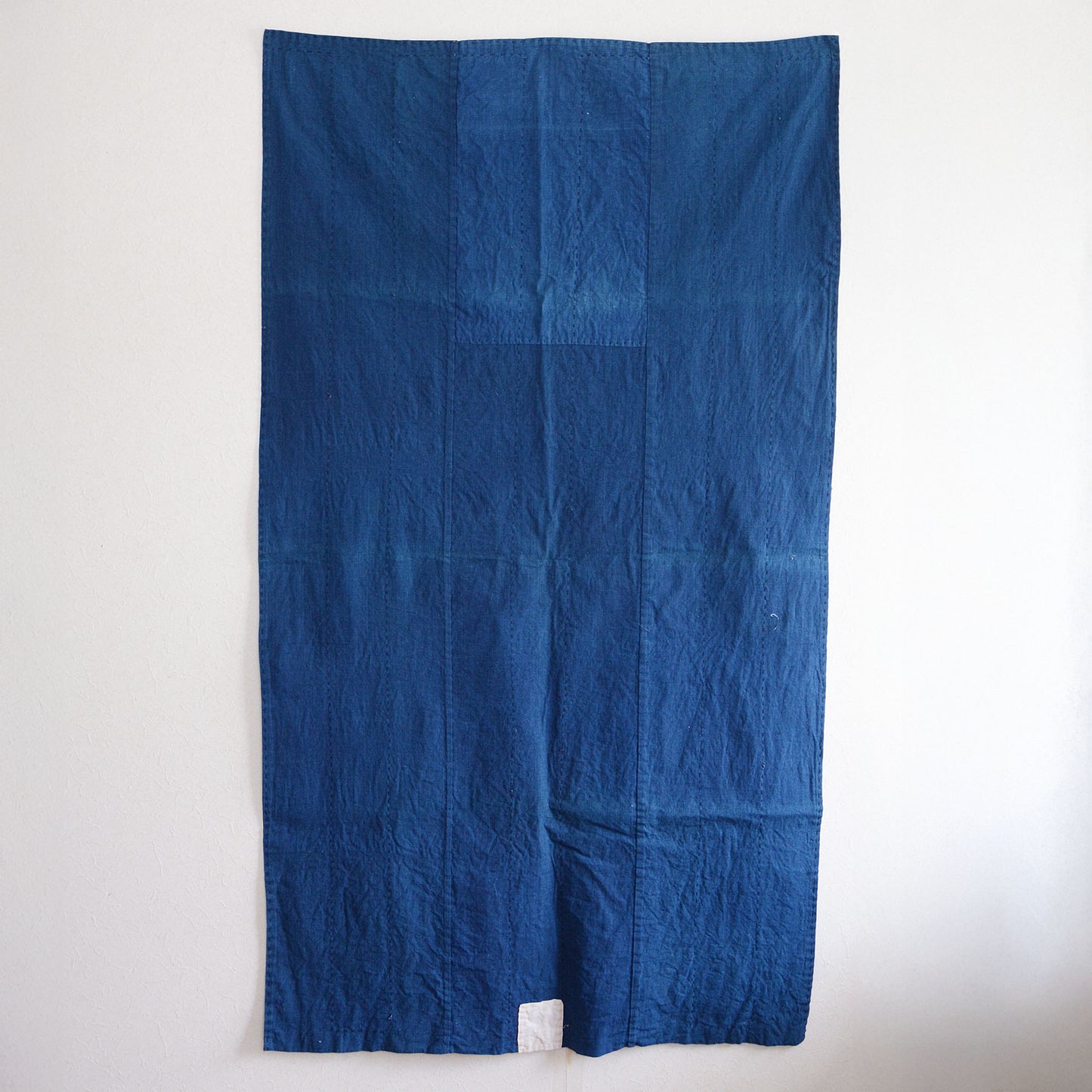 Indigo-dyed Japanese fabric with decorative white accents