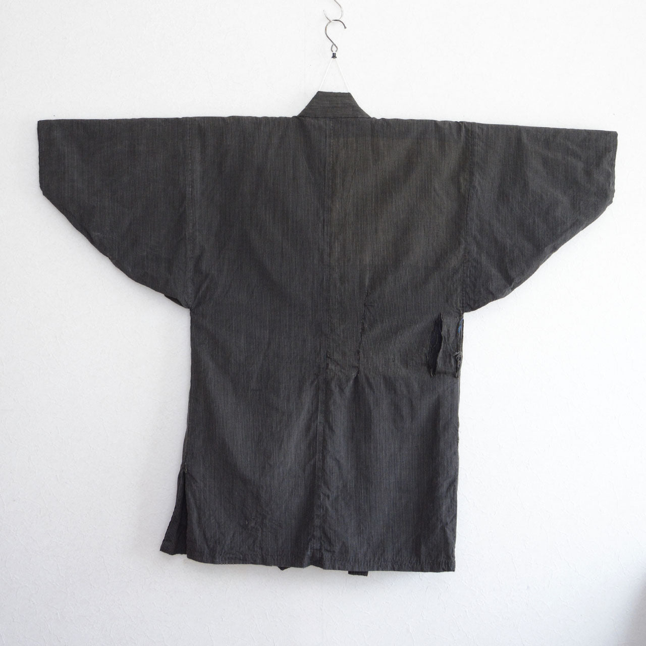 Traditional Japanese cotton noragi with visible wear and hand stitching
