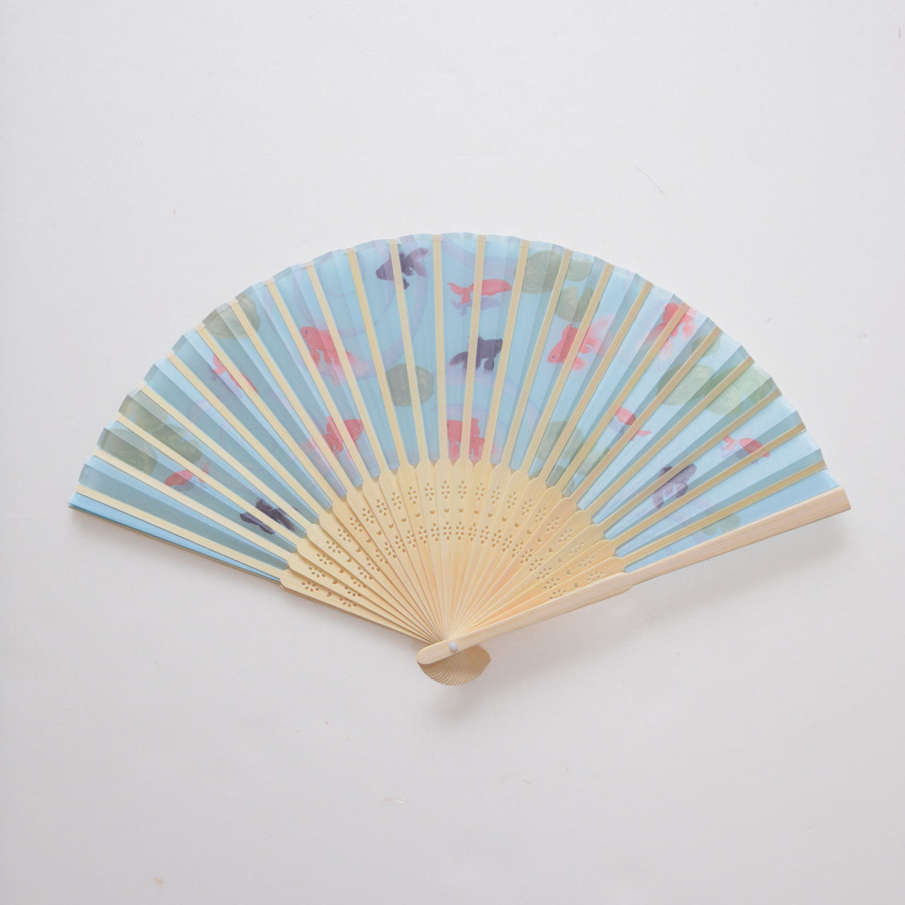 Elegant hand fan with vibrant red and black goldfish artwork