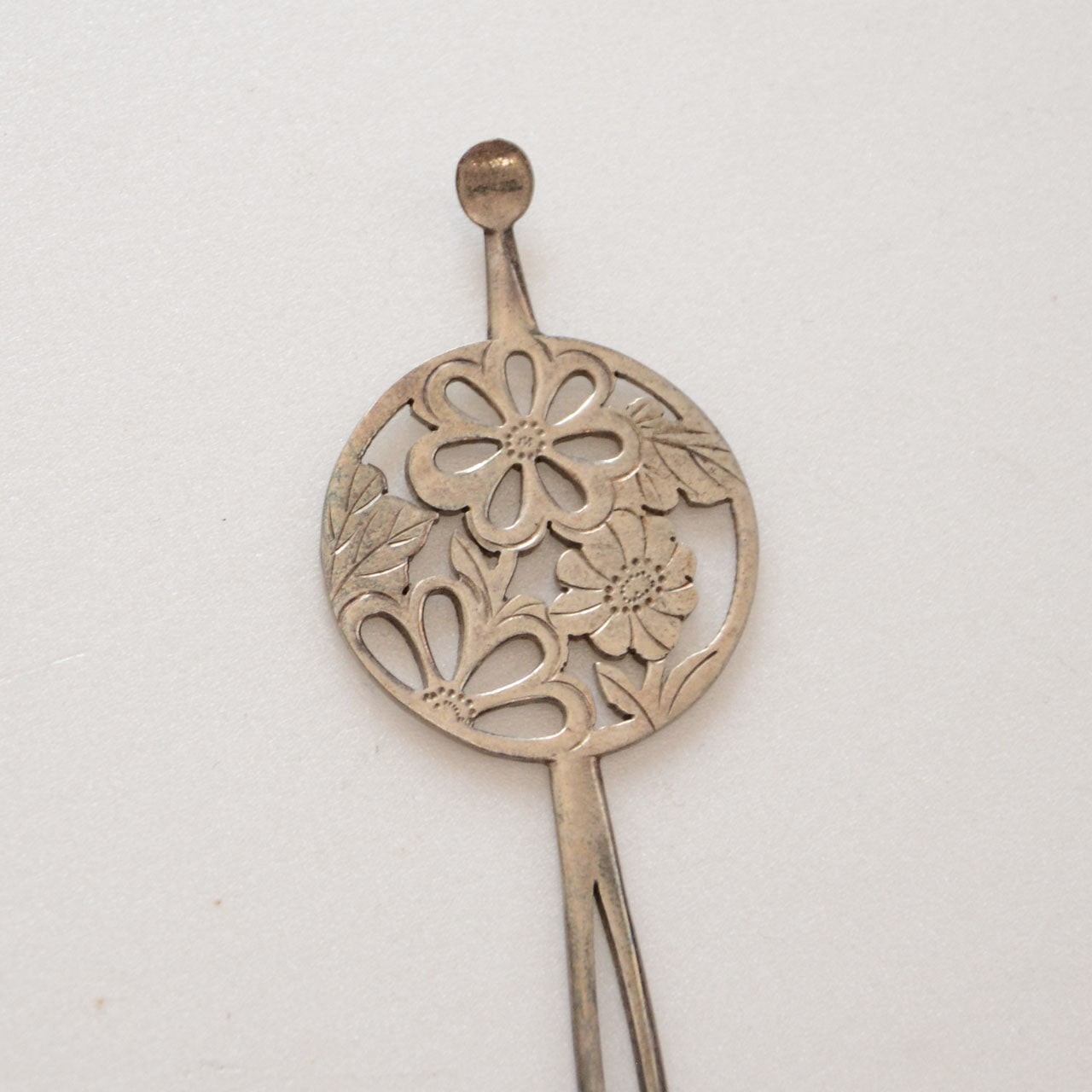 Classic Japanese hair ornament with circular floral cutout pattern and original box
