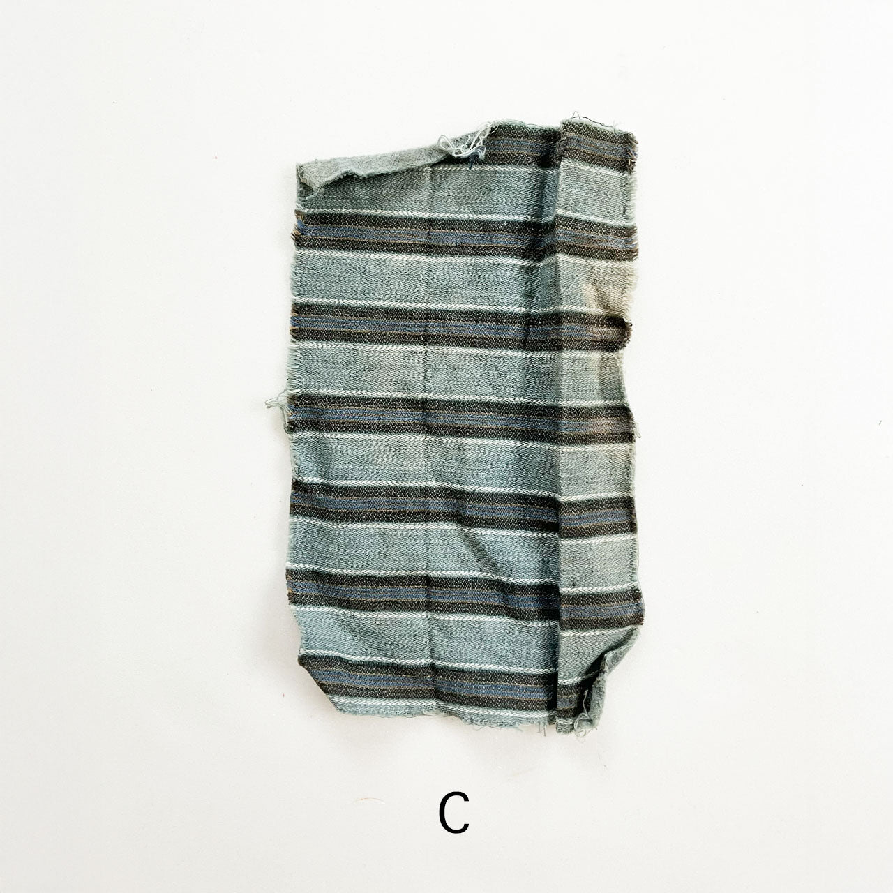Japanese cotton fabric remnants in indigo tones with striped and kasuri patterns for quilting projects