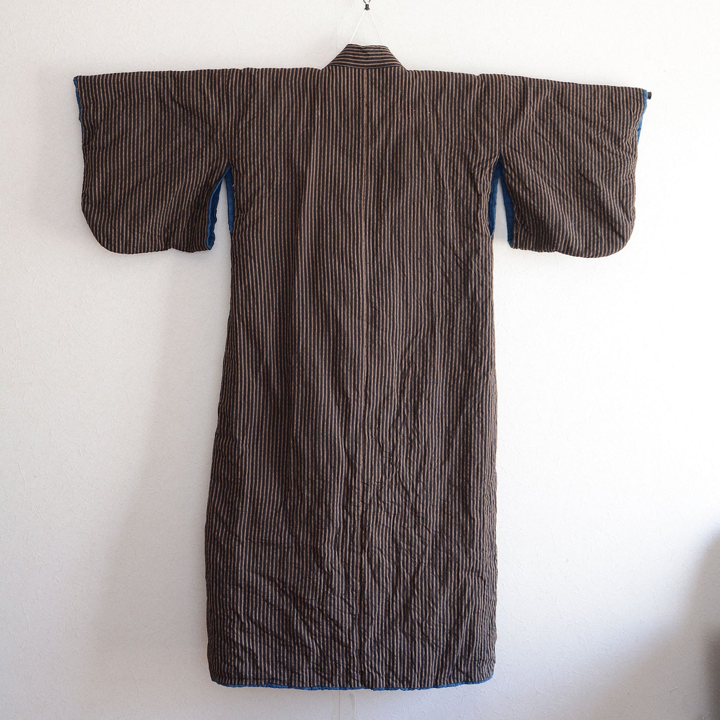 Traditional Japanese workwear style padded kimono robe with indigo stripes
