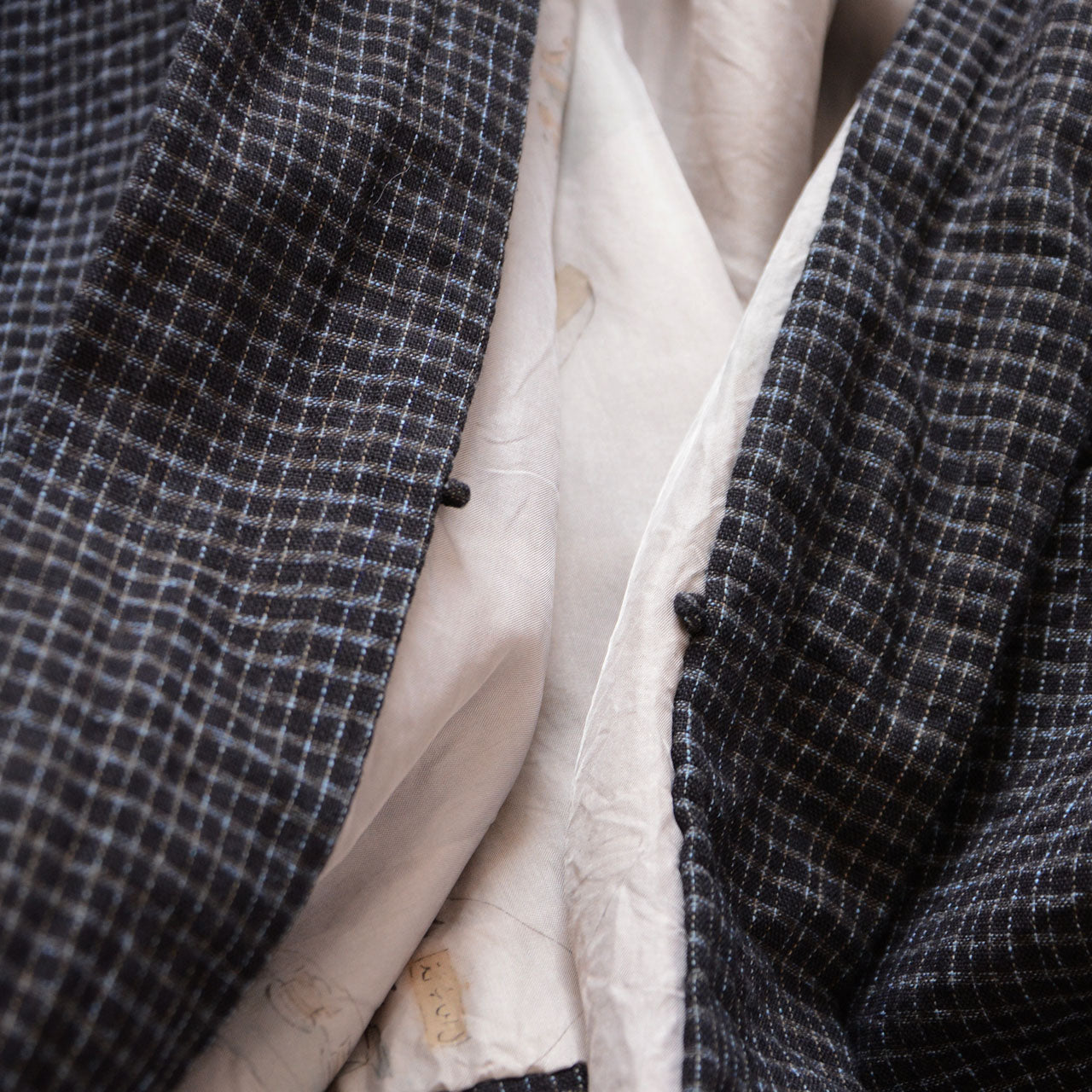 Plaid vintage kimono jacket with hidden lining showing everyday scenes of Edo townspeople