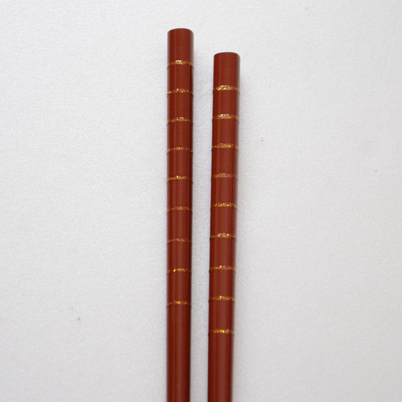 Natural bamboo chopsticks with gold accent stripes