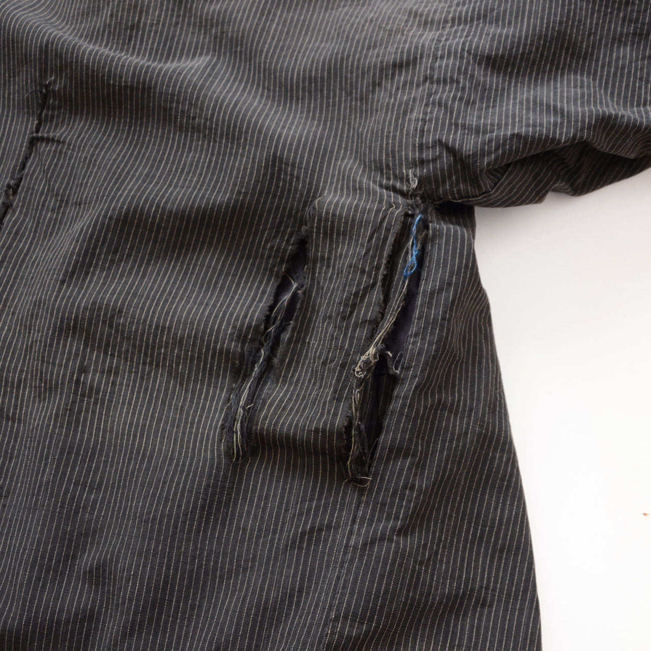 Japanese vintage jacket with sashiko-style repair and frayed fabric