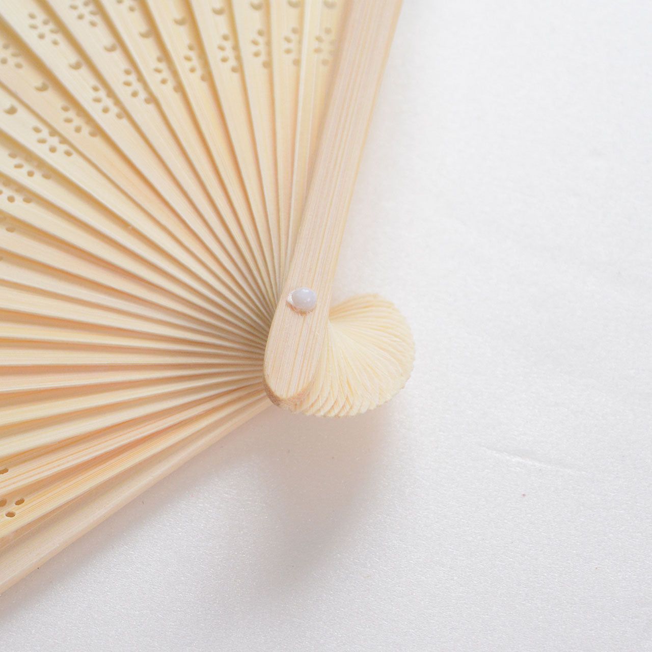 Vintage-inspired folding fan with aquatic goldfish design
