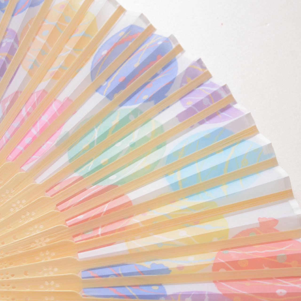 Traditional-style fan with vibrant seasonal pattern