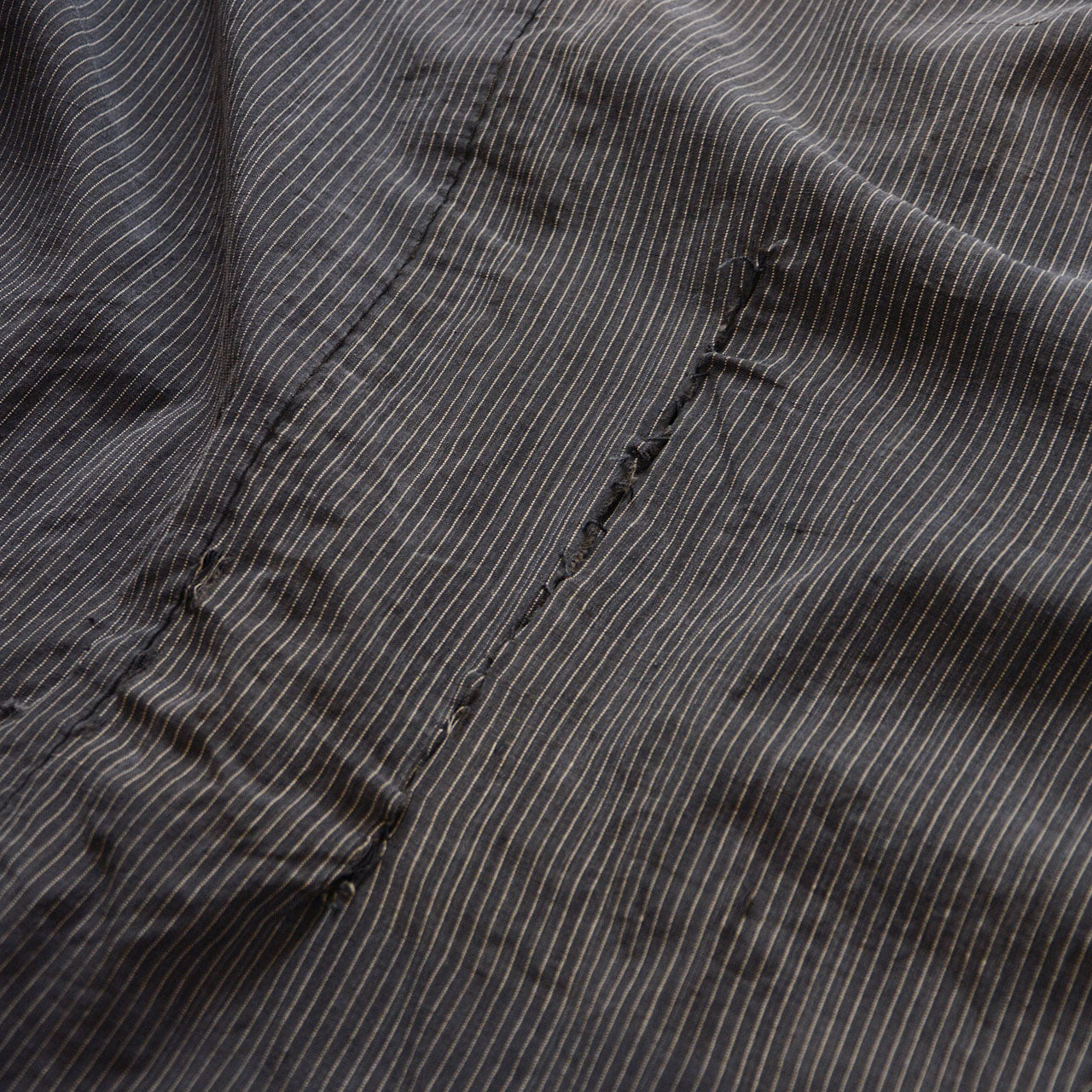 distressed Japanese noragi with rough hand-sewn repair