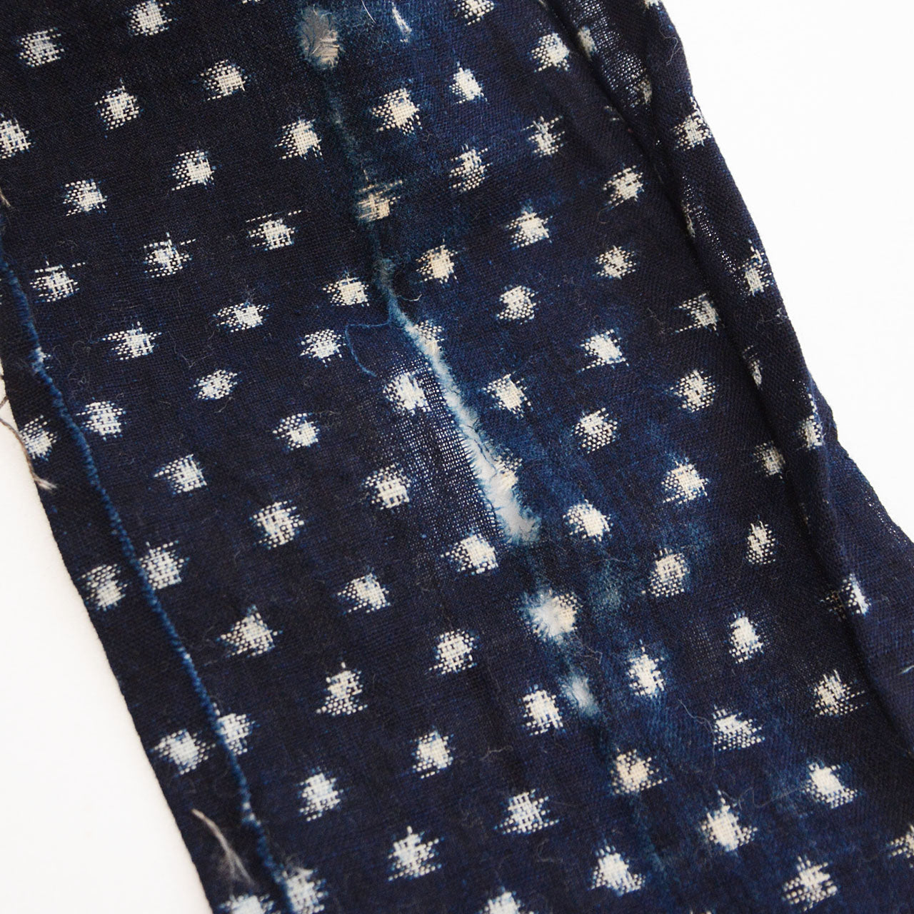 Five assorted vintage Japanese fabric swatches with indigo, stripes, and kasuri weaving patterns