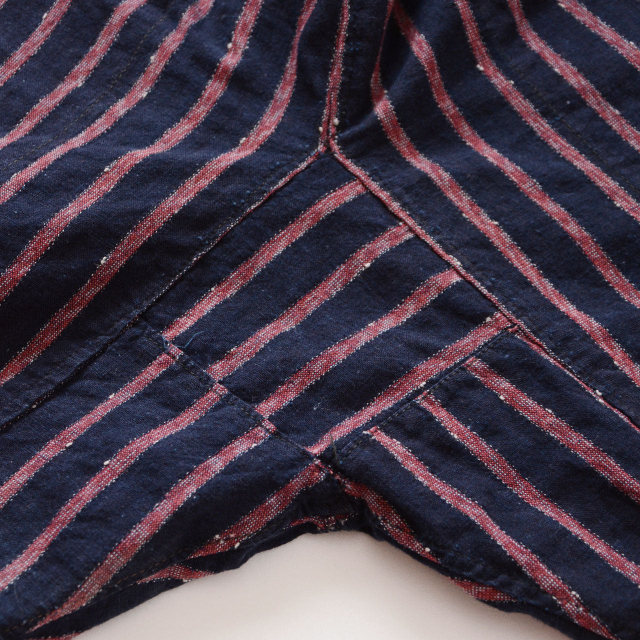 Hand-reinforced vintage noragi trousers in cotton with metal ankle fasteners