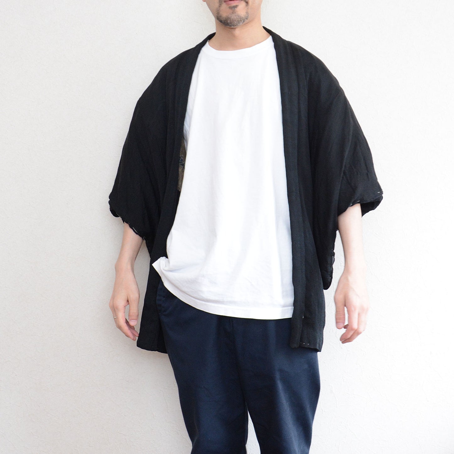 Formal black Japanese haori featuring Karashishi lion and traditional crests