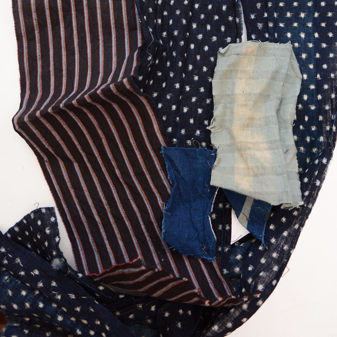 Vintage Japanese cotton fabric scrap bundle in indigo hues with stripe and kasuri motifs for quilting
