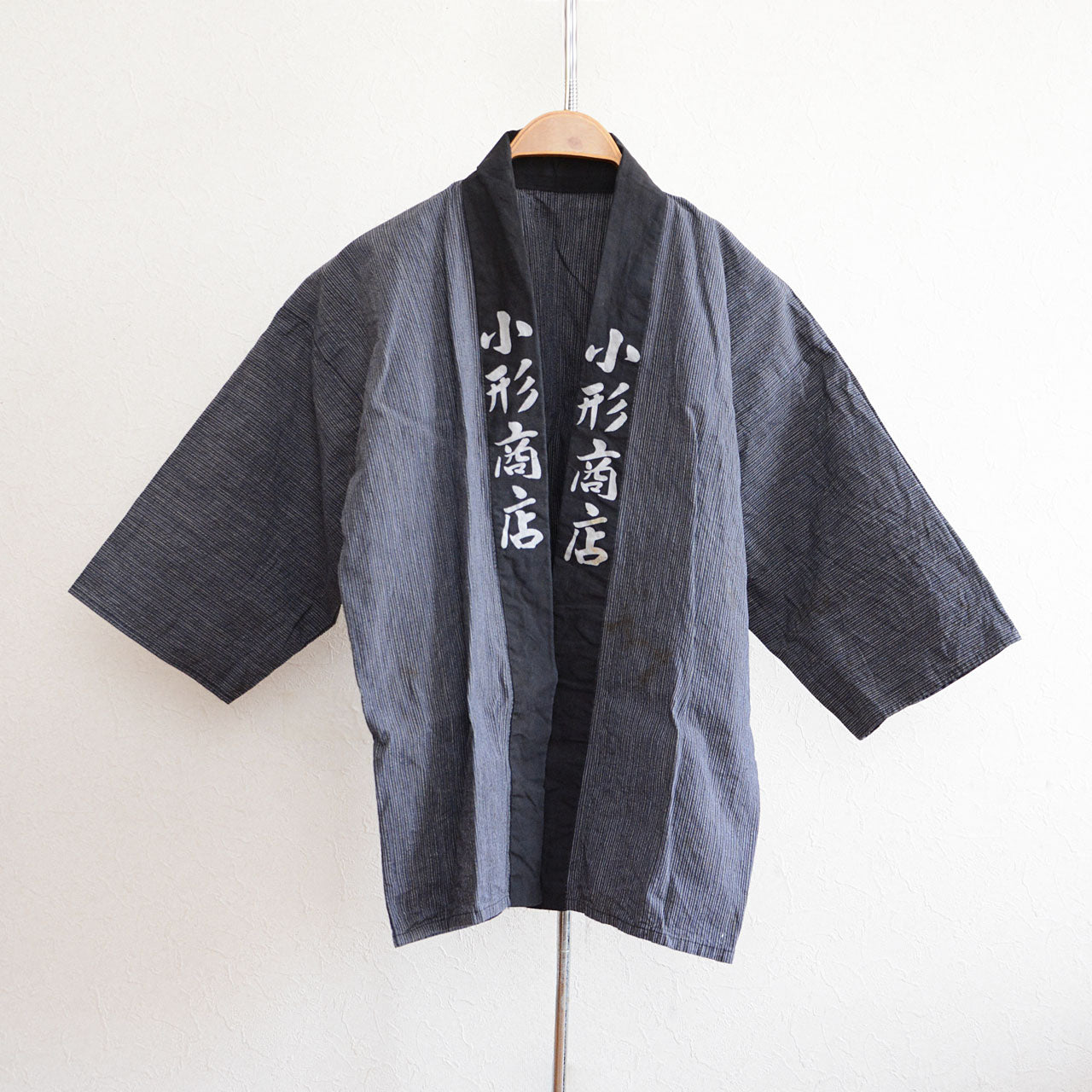 Vintage Japanese happi jacket with bold kanji collar design from mid-Showa era