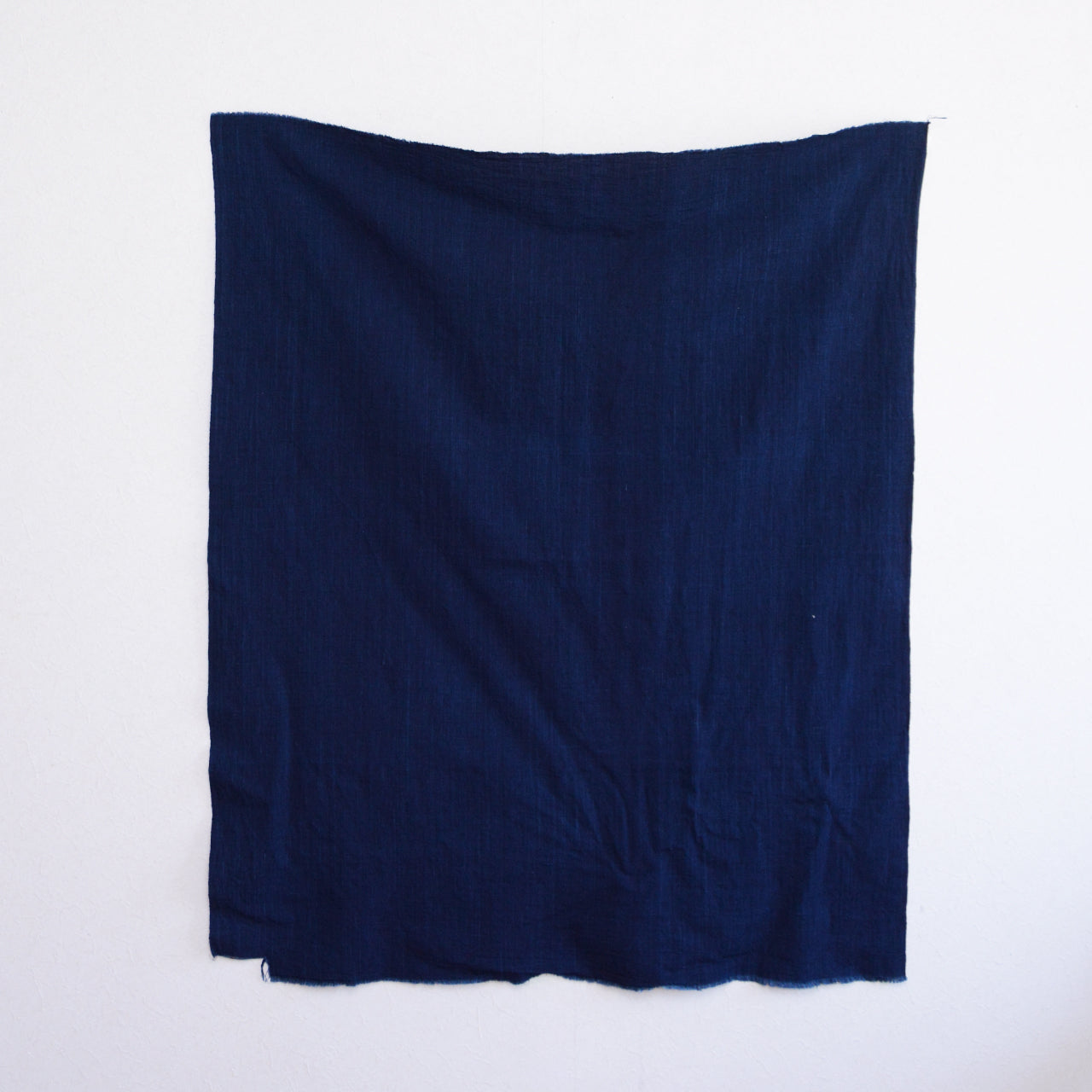 Mid-Showa era aizome fabric with worn edges, perfect for remaking and patchwork crafts.