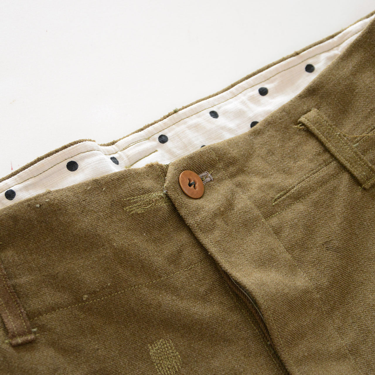 Mid-century Japanese vintage trousers with repaired details and dotted pocket lining