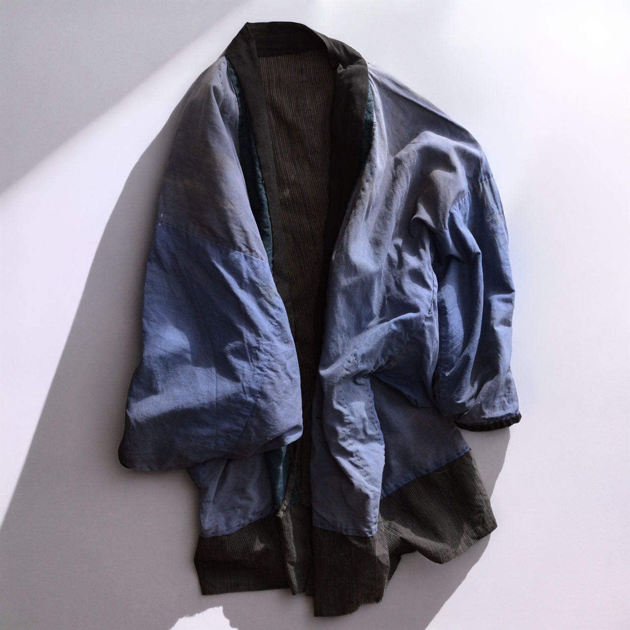 Two-sided Japanese Noragi jacket with faded and repaired fabric
