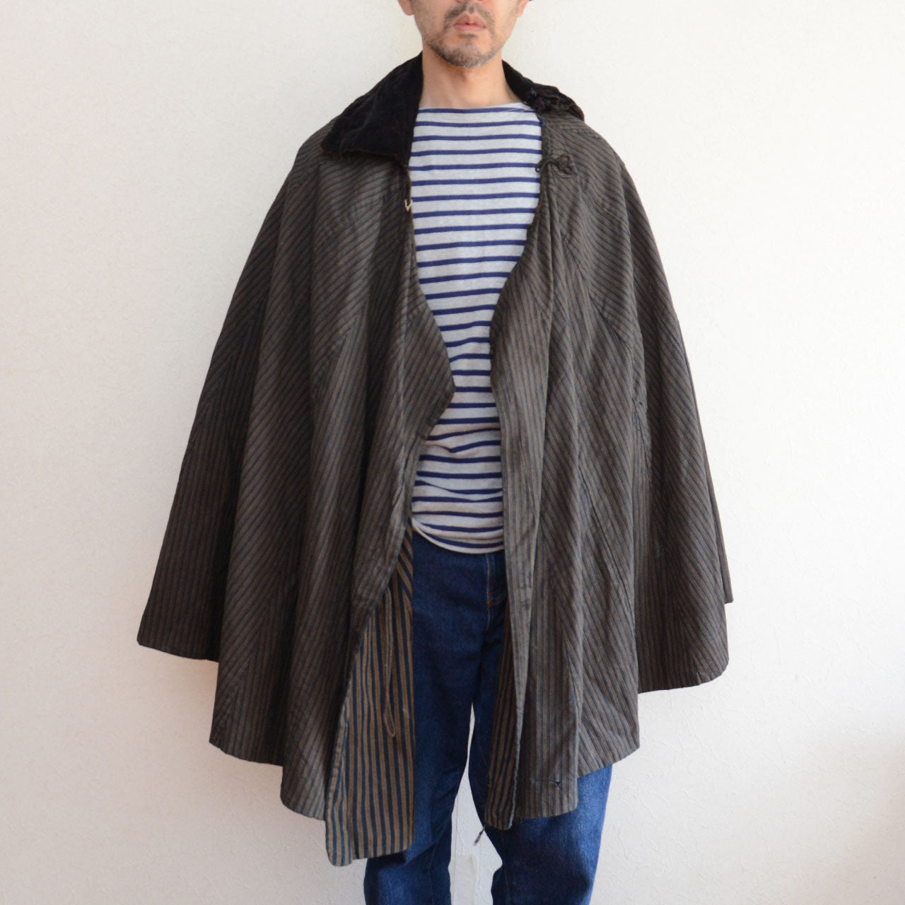 Antique Japanese Dochu Kappa rain cape, traditional cotton garment representing travel and market culture