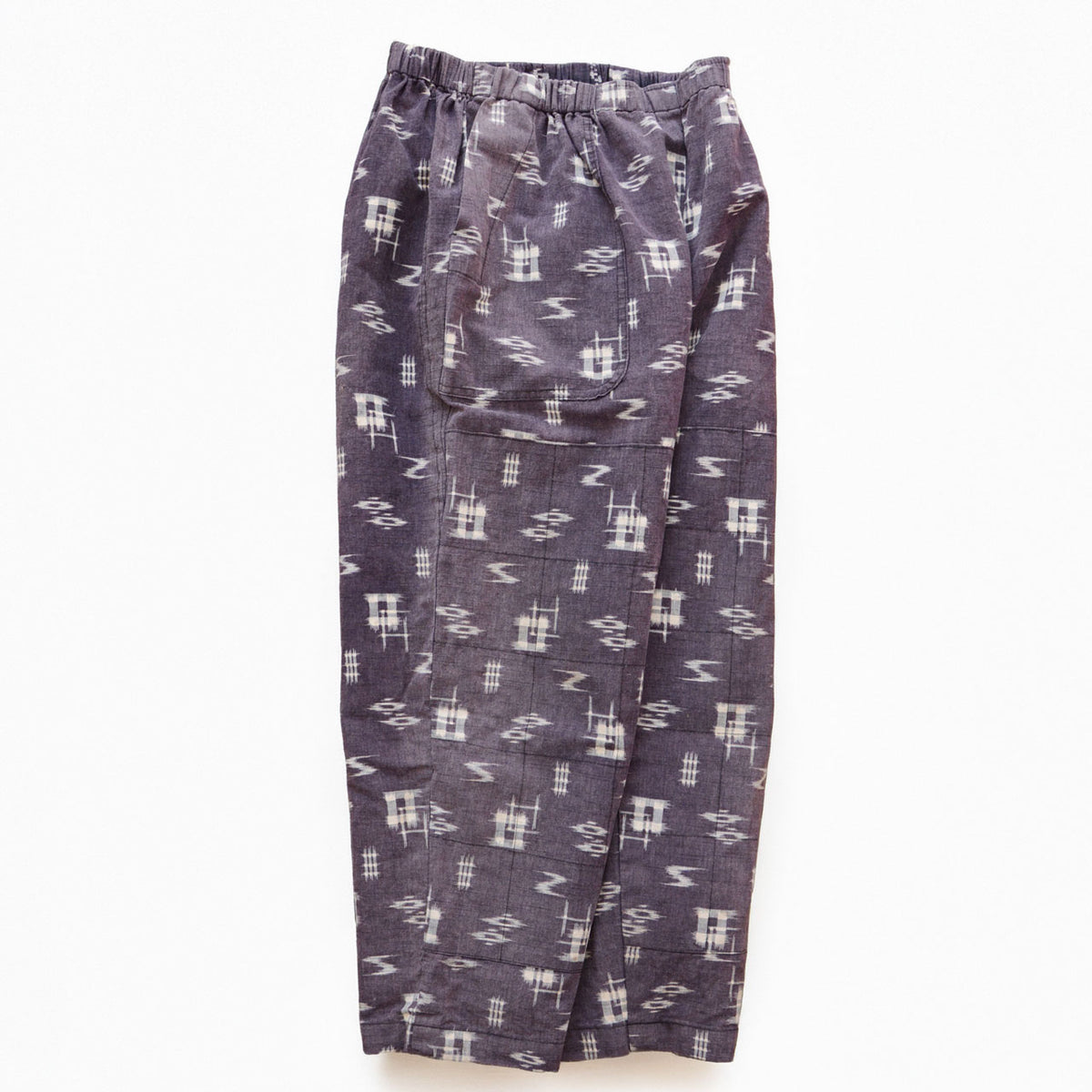 Showa-era Japanese vintage cotton kasuri monpe pants with a long front pocket and grid-stitched outer reinforcement