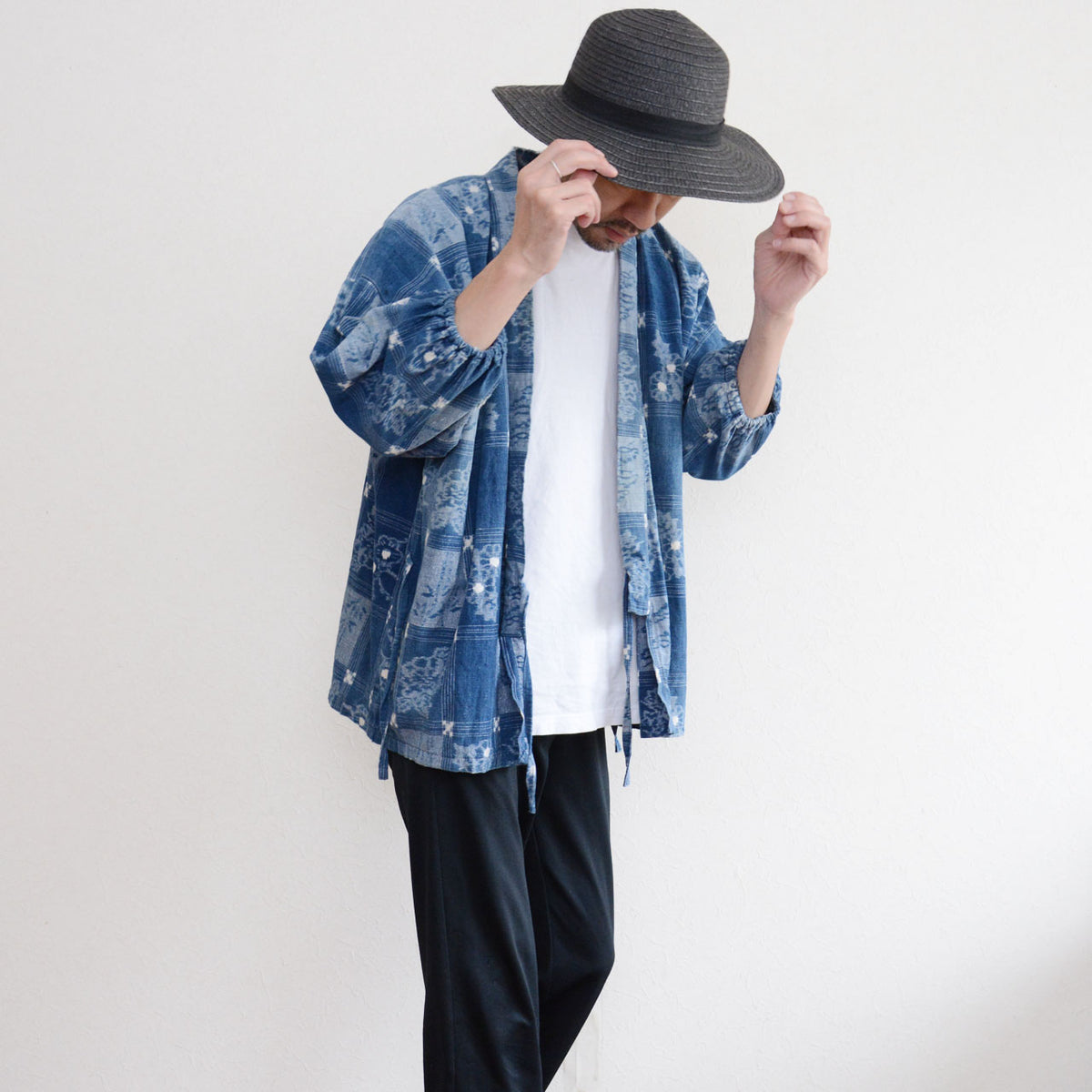 Vintage indigo cotton uwappari noragi jacket worn with a white T-shirt and black trousers