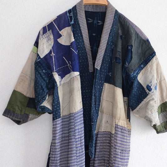 Vintage Japanese boro noragi jacket with crazy patchwork — indigo kasuri, shibori, and mixed cotton fabrics, Showa era