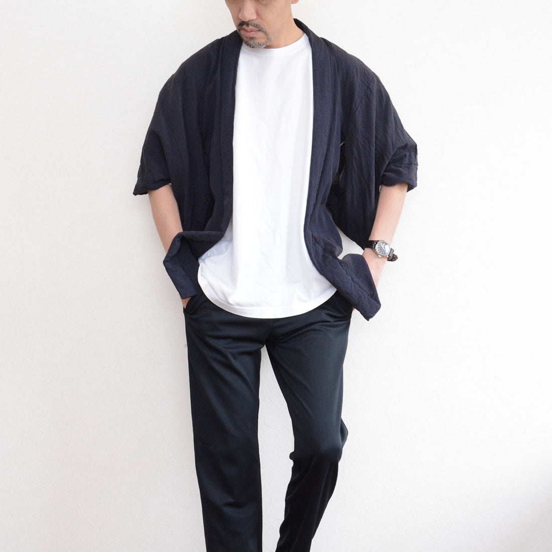 171 cm male model wearing a deep navy Japanese vintage haori kimono jacket over a white T-shirt and black trousers