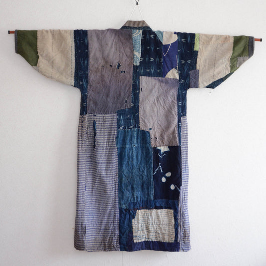 Vintage Japanese boro noragi jacket with crazy patchwork — indigo kasuri, shibori, and mixed cotton fabrics, Showa era