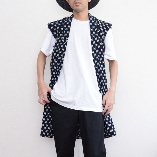 Indigo kasuri sleeveless haori vest styled with white t-shirt, black trousers and brimmed hat, front view