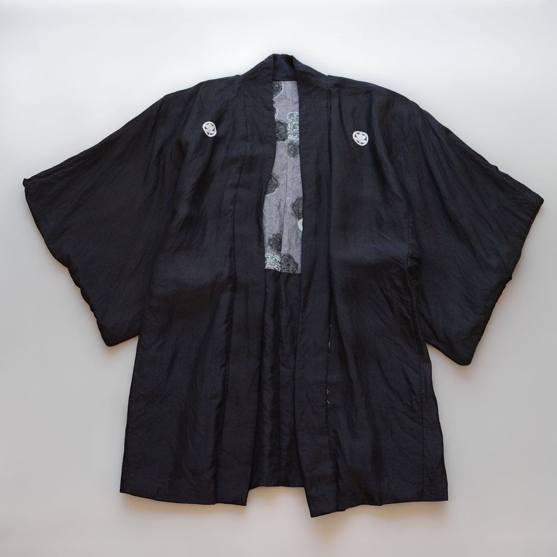 Black montsuki haori jacket with five white dyed family crests, Showa era Japan vintage
