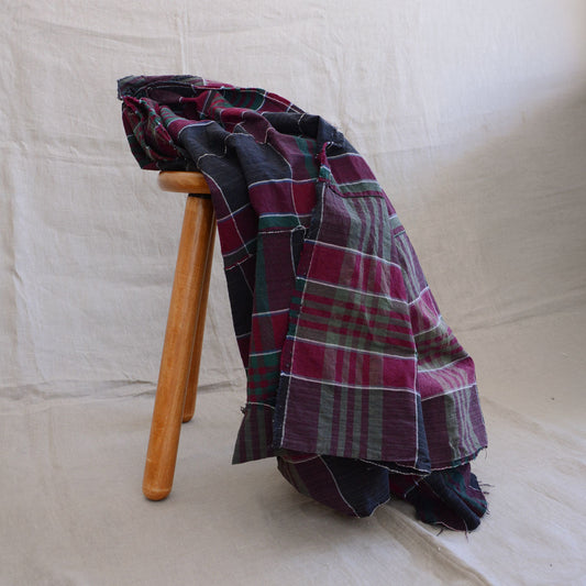 Antique Japanese futon cover cotton plaid fabric, mid-Showa era, draped over wooden stool