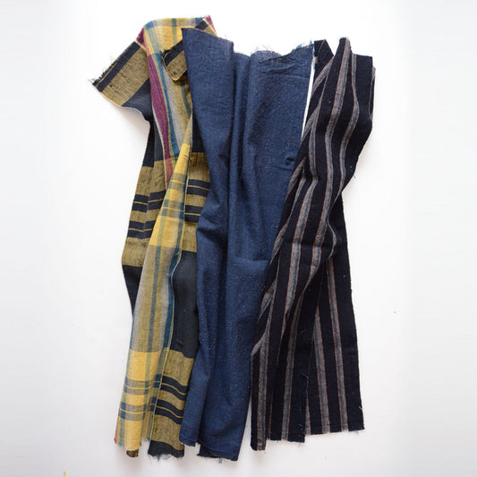 Japanese vintage cotton fabric set - multicolor plaid, indigo solid, and indigo stripe, three pieces laid flat, Showa era antique
