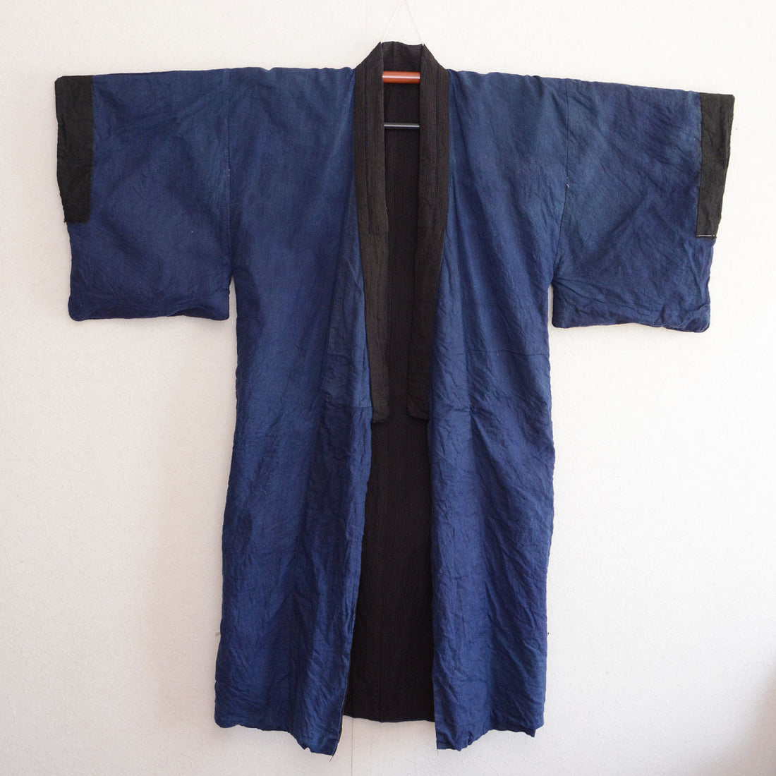 Lining side full view, front — deep blue solid cotton on kimono hanger, early Showa era Japan vintage men's kimono