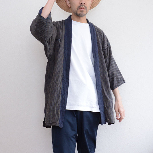 Indigo stripe cotton noragi jacket worn over white tee and navy slacks, indigo collar lining visible, Japan vintage boro Showa era