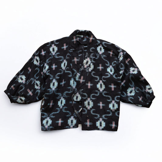 Dark navy cotton kasuri noragi uwappari jacket with white and red cross ikat pattern, Showa era Japan vintage, flat lay detail