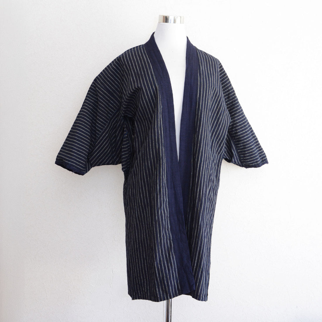 Early Showa-era indigo stripe noragi from Tohoku, Japan. Front view, vintage cotton work jacket.