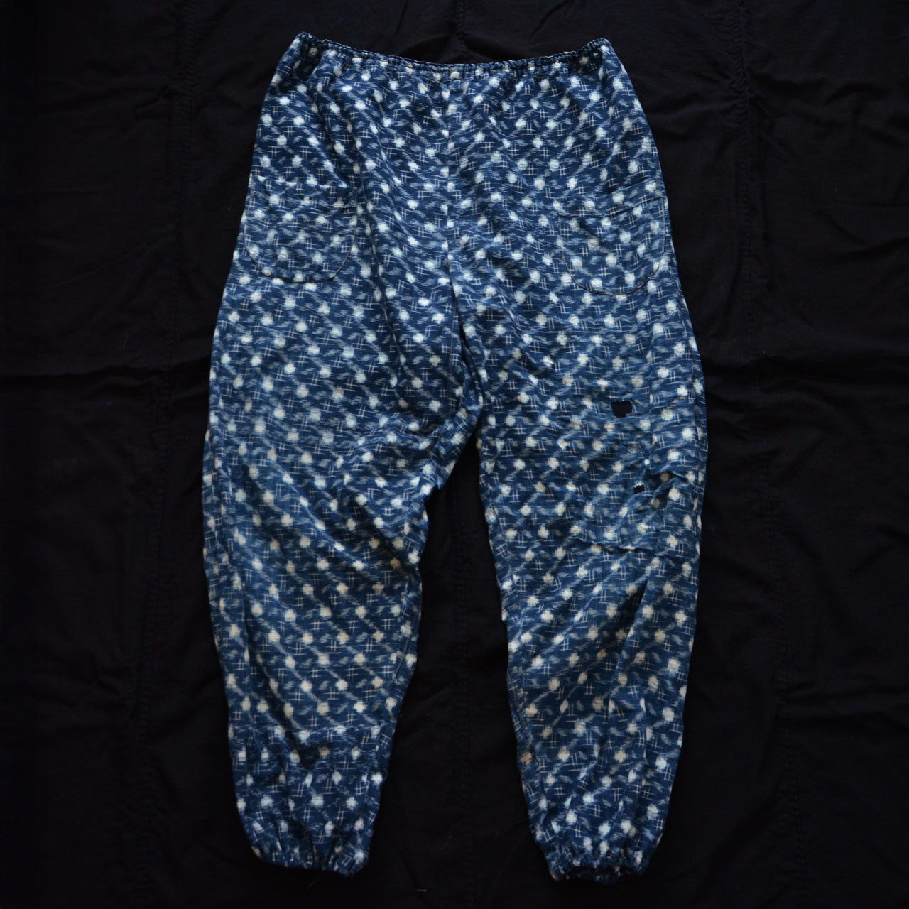 Artisan-quality indigo kasuri pants with authentic boro mending