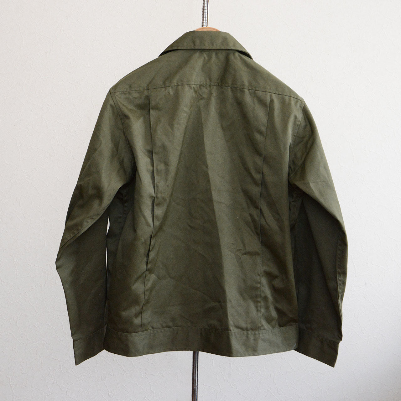 olive drab jacket with wide body and short length