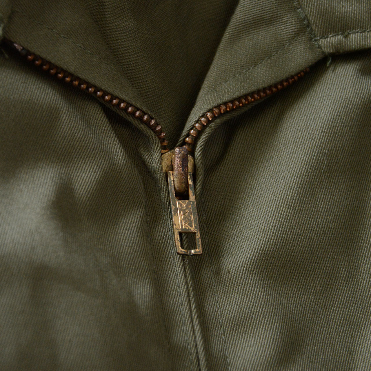 vintage olive jacket with structured shoulders