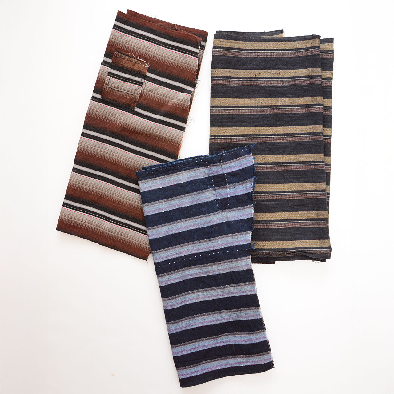 Vintage Japanese striped cotton fabric with hand-stitched repairs