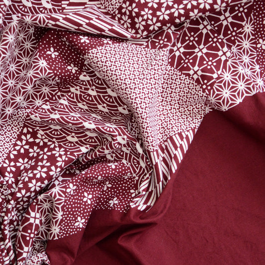 Vintage Japanese furoshiki with traditional patterns in burgundy and white