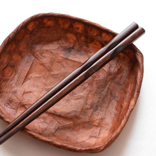 Japanese chopsticks made of natural wood with carved grip