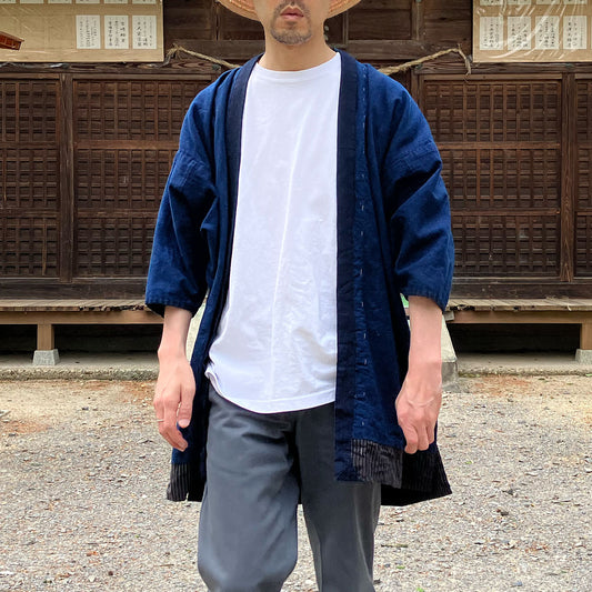 Man wearing a Noragi jacket in natural outdoor setting