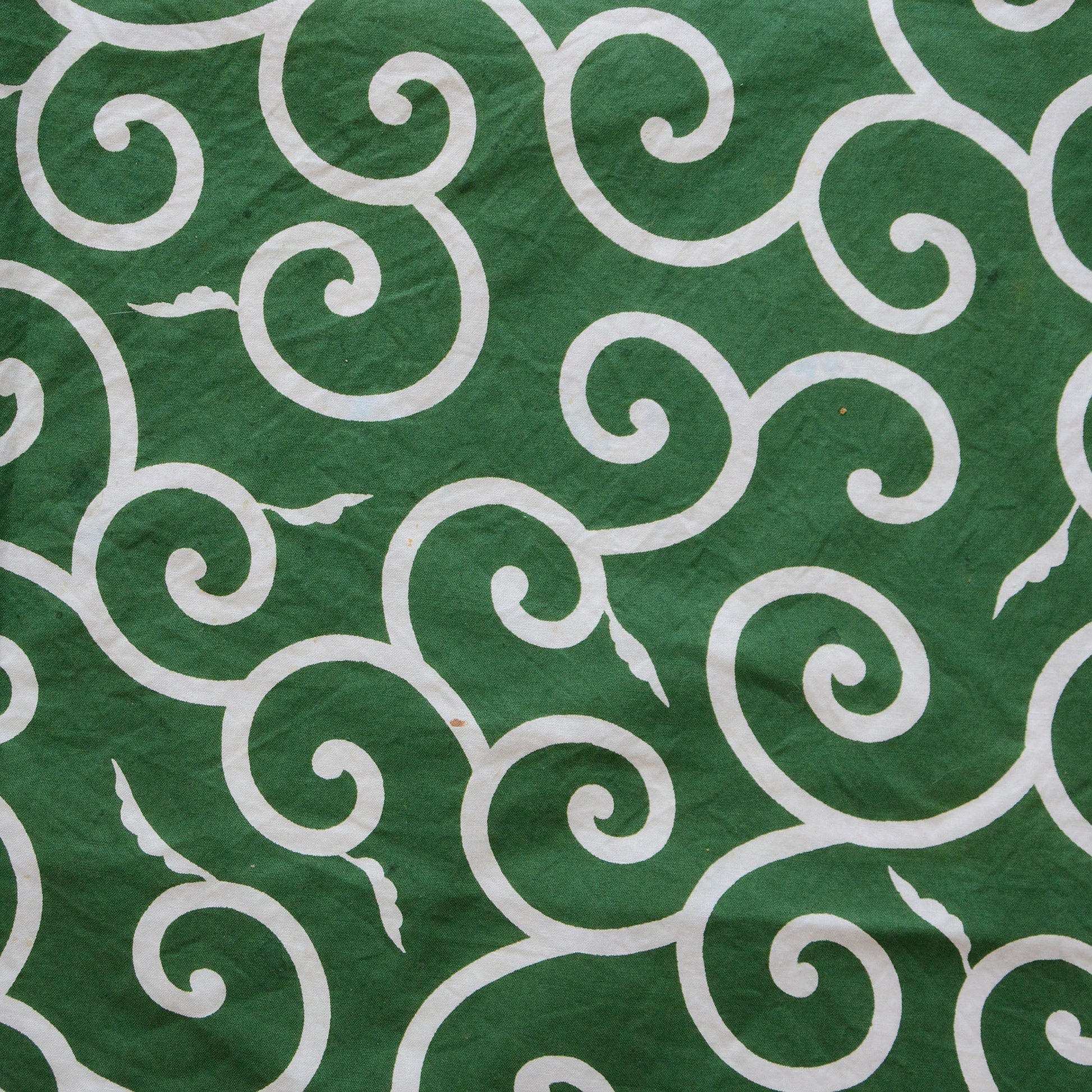 Green furoshiki cloth with traditional Japanese karakusa pattern